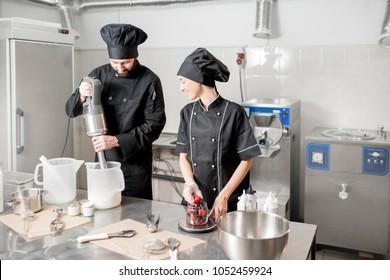 Chefs Mixing Berries With Milk And Sugar For Ice Cream Production In The Small Ice Cream Manufacturing