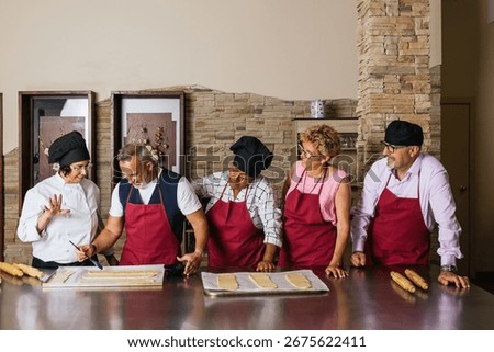Chefs showing bread making techniques during cooking class