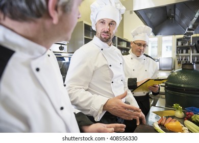 Chefs talking about the meal ingredients - Powered by Shutterstock