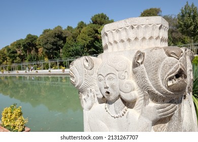 Chehel Sotoun Palace outdoor view, Persian stone sculpture figures at garden, Isfahan, Iran, September 2016.