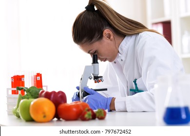Cheking Food Quality At Professional Lab With Microscope, Advanced Food Technology