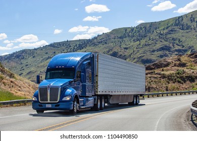Chelan, Washington state, USA - May 30, 2018: Semi truck with trailer driving on highway