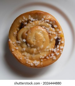 A Chelsea Bun On A White Plate