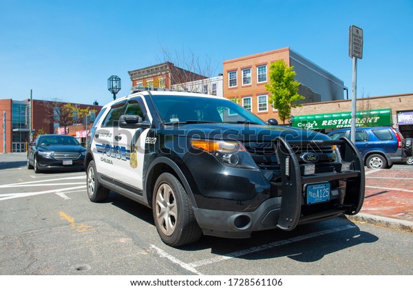 CHELSEA, MA, USA - MAY 9, 2019:\
Police car of Chelsea in front of Chelsea Police Department at 19\
Park Street in downtown Chelsea, Massachusetts MA, USA.\
