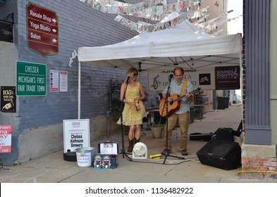 CHELSEA, MI / USA - JULY 12, 2018:  Dave Boutette And Kristi Lynn Davis Perform At The Chelsea Sounds And Sights On Thursday Nights Festival. 

