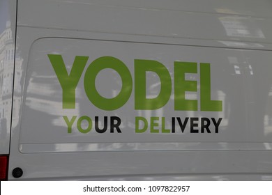 Cheltenham, Gloucestershire, England, UK. 14 May 2018. A green Yodel sign on the side of a white delivery van.
