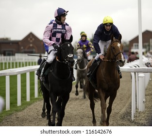 CHELTENHAM, GLOUCS, OCT 19 2012, Jockeys Jimmy McCarthy And Ruby Walsh Return From The Third Race At Cheltenham Racecourse, Cheltenham UK Oct 19 2012