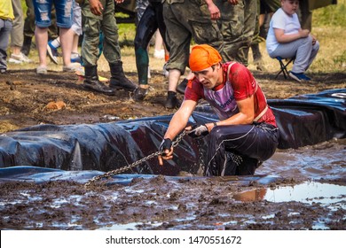 CHELYABINSK, Russia - 24 June 2019: obstacle race called "race of heroes". endurance competition with the overcoming of running hills, mud, water and sports military obstacles. - Shutterstock ID 1470551672