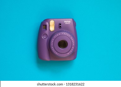 Chelyabinsk, Russia - February 15, 2019: Fujifilm instax mini camera on blue background