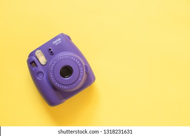 Chelyabinsk, Russia - February 15, 2019: Fujifilm instax mini camera on yellow background