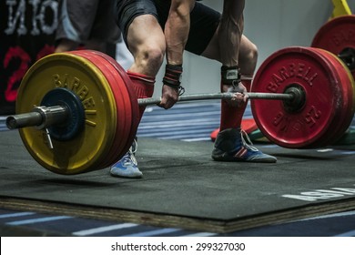 Chelyabinsk, Russia - July 17, 2015: powerlifter athlete getting ready exercises deadlift during National championship powerlifting, bench press and deadlift