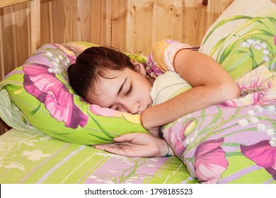 Chelyabinsk, Russia-August 09, 2020:The Girl Is Sleeping On The Bed Wrapped In A Blanket. Close Up.