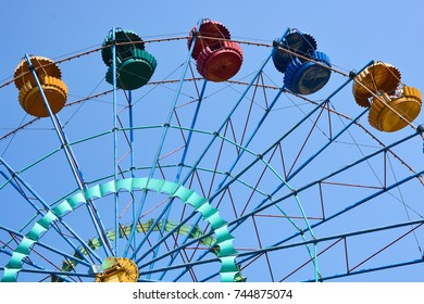 Chelyabinsk,Russia - AUGUST 8,2016:Ferris Wheel with multicolored cabins in the Park on blue sky background - Shutterstock ID 744875074