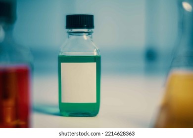 Chemical Bottle With Blank Sticker In Chemistry Lab