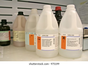Chemical bottles on wet bench in the lab
