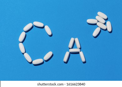 Chemical Element Calcium Sign Made Of Supplement Pills.