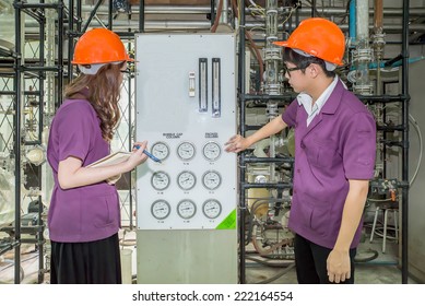 Chemical Engineer Student Checking Equipment In Control Room For Training