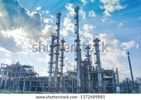 Chemical factory. Elastomer and thermoplastic production line. Vats for preparing monomers and polymerization and steel pipeline for delivering components. Industrial area near the petrochemical plant