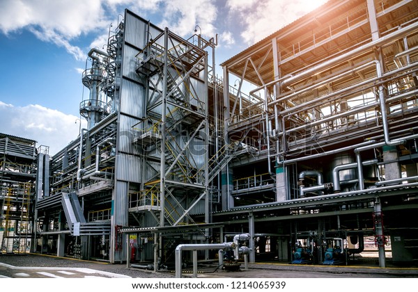 Chemical factory. Elastomer and\
thermoplastic production line. Vats for preparing monomers and\
polymerization and steel pipeline for delivering\
components.
