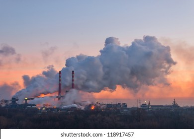 Chemical Factory In The Morning, With Pipes And Smoke, Long Exposure