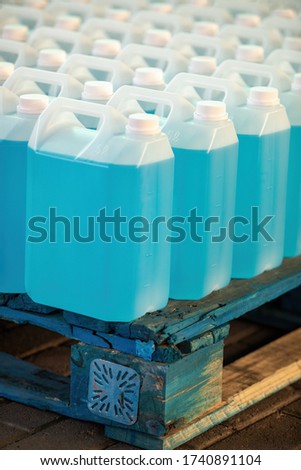 chemical factory producing bulk hand sanitizer in 5 liters plastic containers