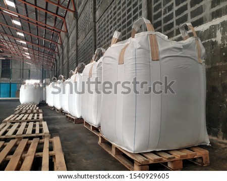 Chemical fertilizer Urea Stock pile jumbo-bag in warehouse waiting for shipment.