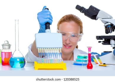 chemical laboratory scientist woman working with multi channel pipette - Powered by Shutterstock