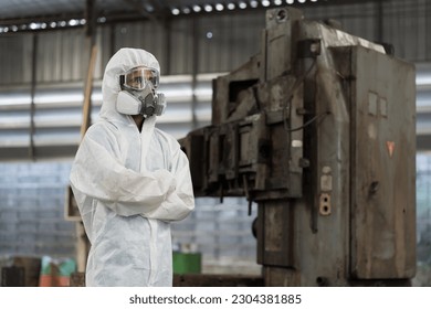 Chemical leak and safety first concept. Chemical specialist wear safety uniform, gas mask working in chemical dangerous area in the industry factory