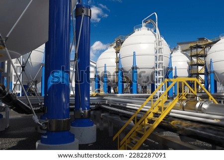 Chemical manufactory. Industrial area with round tanks. Chemical factory in sunny weather. Industrial landscape. Spherical tanks for chemical products. Modern manufactory. 