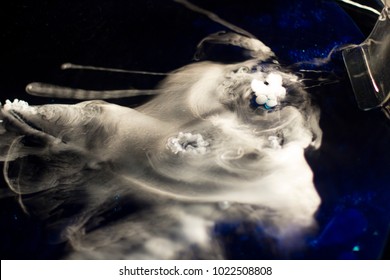 Chemical Reaction With Gases; Mix Of Gases On A Dark Background