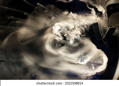 Chemical Reaction With Gases; Mix Of Gases On A Dark Background