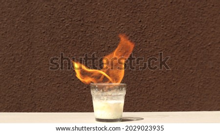 A chemical reaction mixes brake fluid and pool chlorine. Concept of chemical reaction about spontaneous combustion
