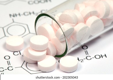 Chemical Structure And Pink Tablets Of Certain Kind Of Medicine In New Drug Discovery Concept And Pharmaceutical Technology.