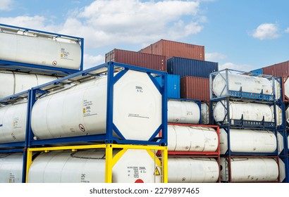 Chemical tank container. ISO tank container for chemical delivery. Bulk liquid transport. Chemical company. Container freight area. Global logistics business. Chemical container for truck transport.