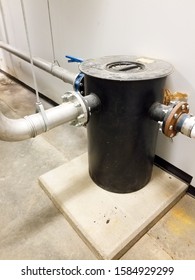 Chemical Tank In Mechanical Room On Concrete Pad