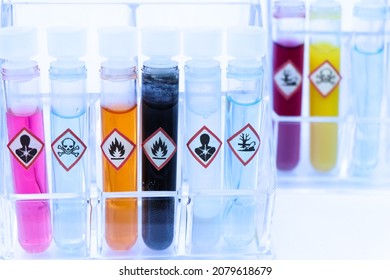 Chemicals in test tubes and symbols used in laboratory or industry 