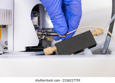 Chemist Connecting Nebulizer To Ion Source Of Mass Spectrometer. Liquid Chromatography With Mass Detector