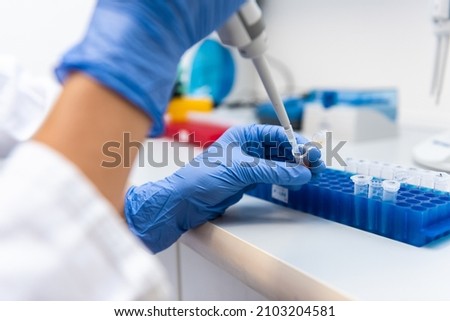 Chemist doing laboratory tests with special equipment.