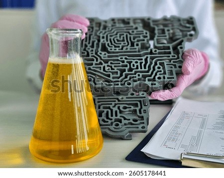 Chemist engine oil on automatic transmission closeup. Quality control of petroleum products