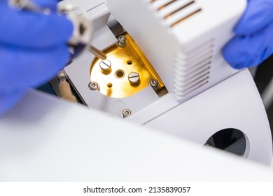 Chemist Inzert A Nebuliser Into Ion Source Of Mass Spectrometer. Liquid Chromatography With Mass Detector. Maintenance Of The Instrument