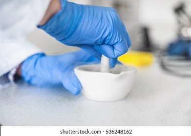 Chemist performs an experiment with liquid nitrogen in laboratory mortar with pestle - Powered by Shutterstock
