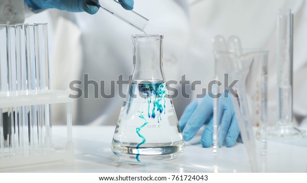 Chemist Pouring Substance Into Conical Flask Stock Photo (edit Now 