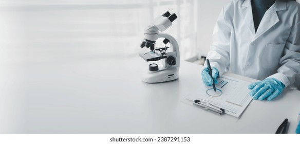 Chemist taking notes on research data, Scientist is working in the laboratory, Chemist is analyzing experimental results and taking notes in the laboratory, lab idea.