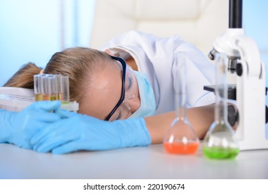 Chemist Woman Tired Sleep On The Table, In The Study Of Chemical Elements In The Laboratory