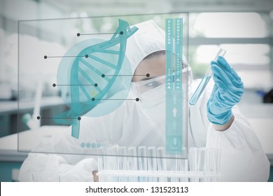 Chemist working cautiously with blue liquid and futuristic interface showing DNA diagram