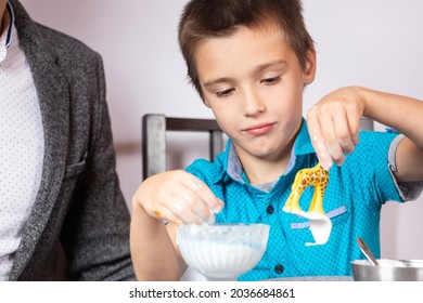 Chemistry Education And Training Concept. Close-up Of A Boy And His Dad Making A Home Experience, Making A Non-Newtonian Liquid From Starch And Water