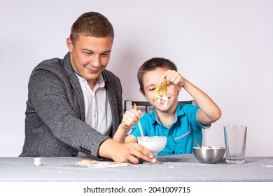 Chemistry Education And Training Concept. Close-up Of A Boy And His Dad Making A Home Experience, Making A Non-Newtonian Liquid From Starch And Water