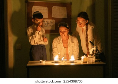 chemistry lessons, female teacher conducting chemical experiments in class with children, Jewish boy, girl with long braid, Israeli school - Powered by Shutterstock