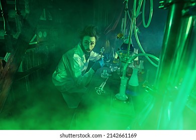 Chemistry Professor Enthusiastically Studying The Contents Of Petri Dishes In His Laboratory. Vintage Style.