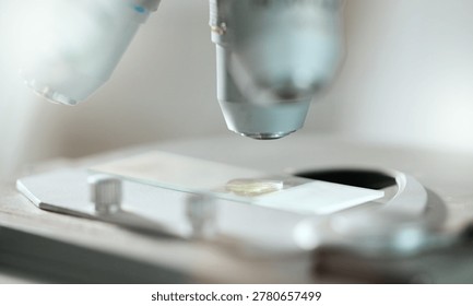 Chemistry, science and microscope with sample in laboratory for medical research, analysis or test. Pathology, forensic study and slide with biotechnology, liquid and dna experiment for development